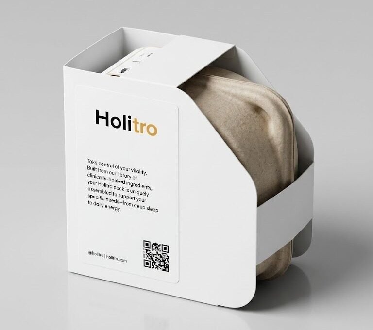 A Holitro pack dispensing a personalized daily pouch containing that day's supplements